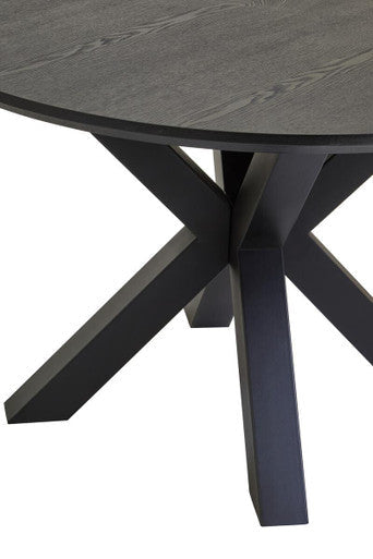 Close-up of the black wood veneer tabletop grain and texture