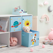Blue space cube bins slotted into a white cube shelving unit in a child's room