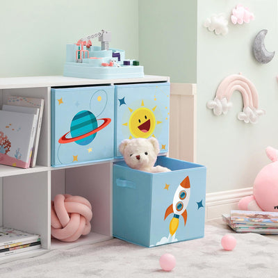 Blue space cube bins slotted into a white cube shelving unit in a child's room