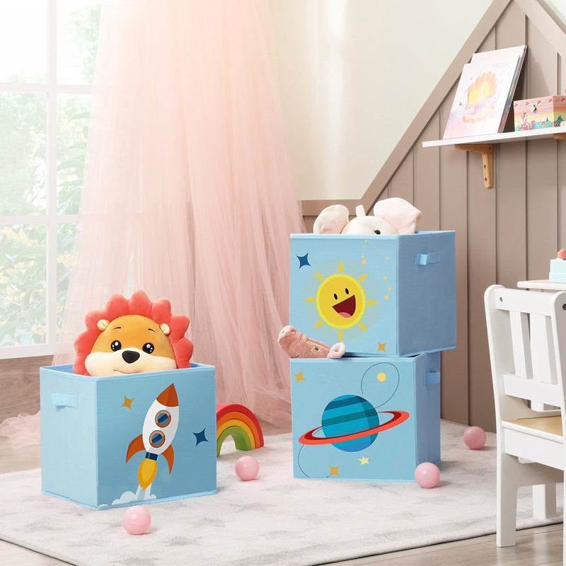 Blue cube bins on a nursery rug holding a lion soft toy and a rainbow