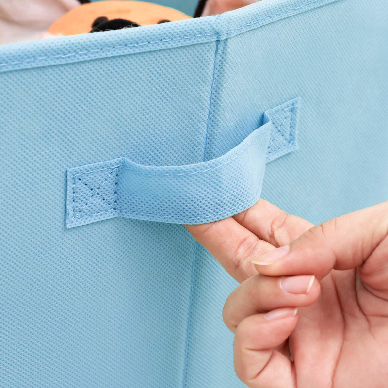 Close-up of a hand pulling the stitched blue fabric side handle