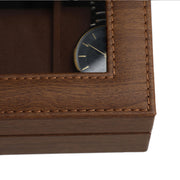 Close-up of the stitched corner of the lid where the glass panel meets the frame