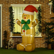 Inflatable gingerbread man standing by a brick-framed window with Christmas garlands
