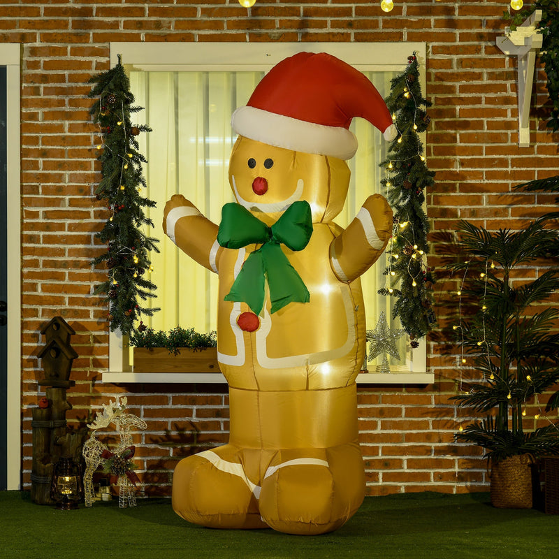 Inflatable gingerbread man standing by a brick-framed window with Christmas garlands