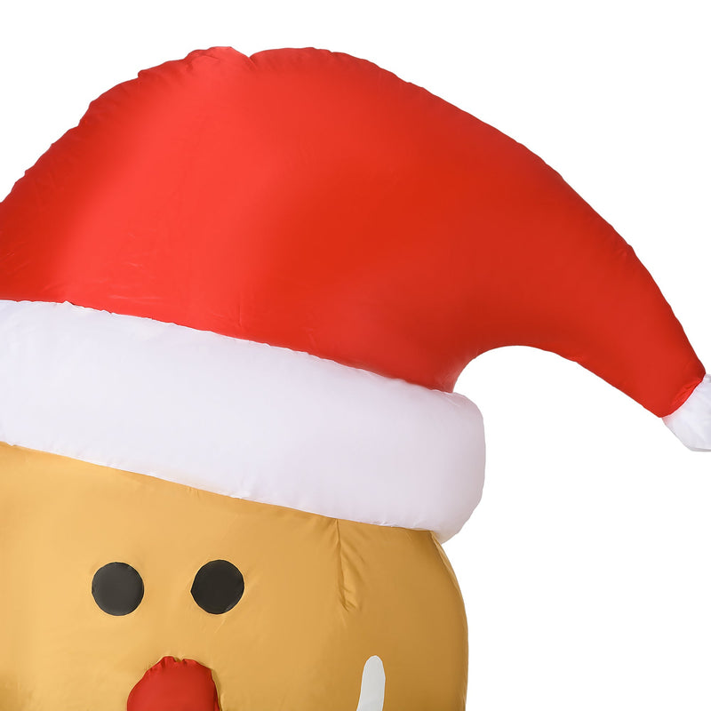 Close-up of the gingerbread man's Santa hat and face