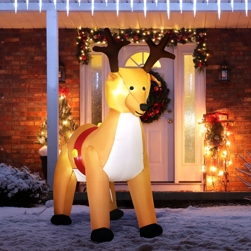 Lit inflatable reindeer in front of a front door with Christmas lights and a wreath
