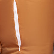 Close-up of a white zip on the brown reindeer fabric