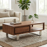 Brown acacia wood coffee table styled in a living room setting