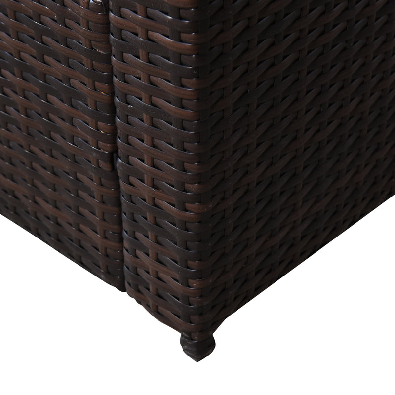 Close-up of the woven rattan corner and the foot of the brown rattan armchair