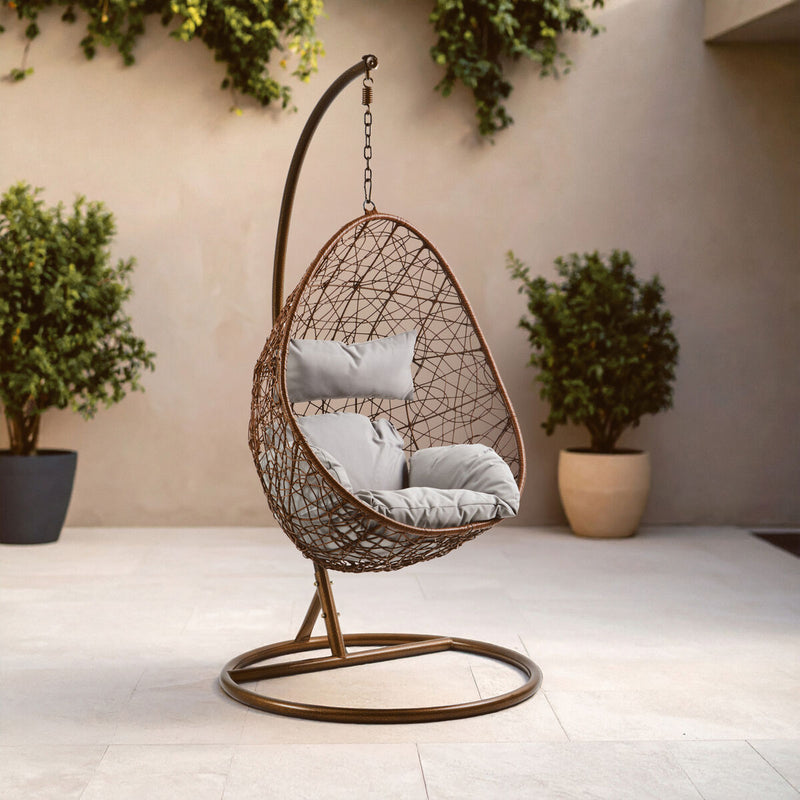 Brown rattan effect hanging chair styled in a living room setting