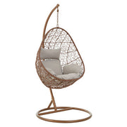 Brown rattan effect hanging chair with grey cushion, plain background