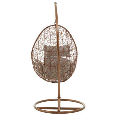 Angled view of the brown rattan hanging chair, plain background