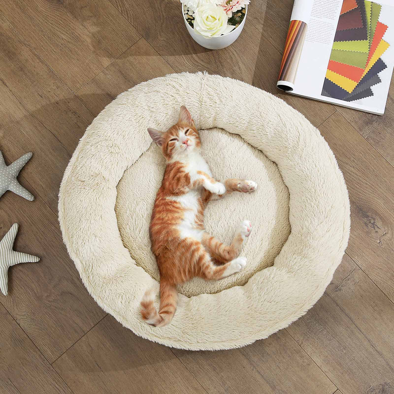 Dog bed shown with a pet resting inside