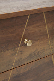 Close-up of the drawer handle and geometric pattern detail