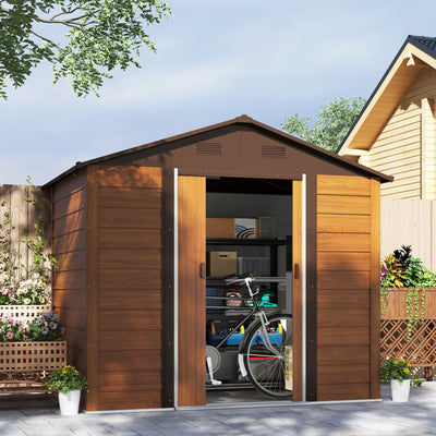 Wood effect shed in a patio garden with the sliding doors open and a bike parked inside