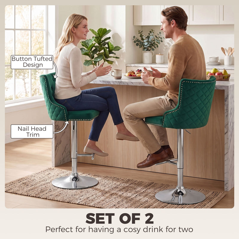 Couple talking across a kitchen counter with a button-tufted design callout on the dark green stool back