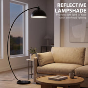 Arc lamp arching over an armchair with text about its reflective lampshade