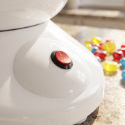 Close-up of the red power button on the white base