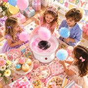 Children at a party enjoying pink and blue candy floss from the machine
