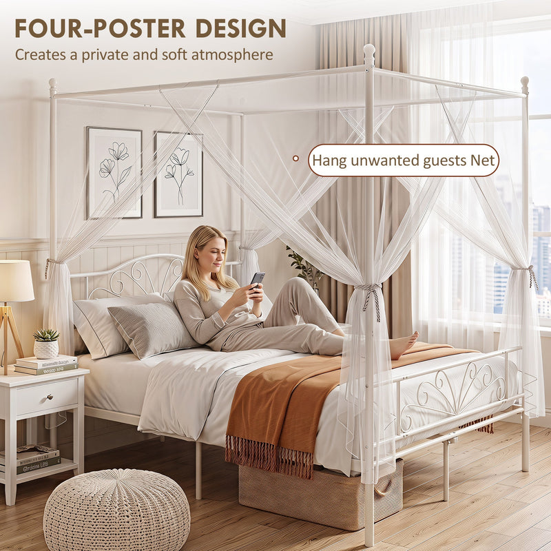 Woman relaxing on the white bed frame with the four-poster net tied back