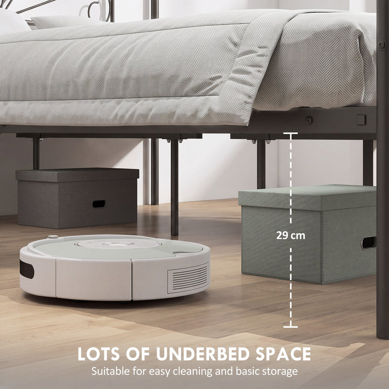 Underbed storage space beneath a black canopy bed frame with storage boxes