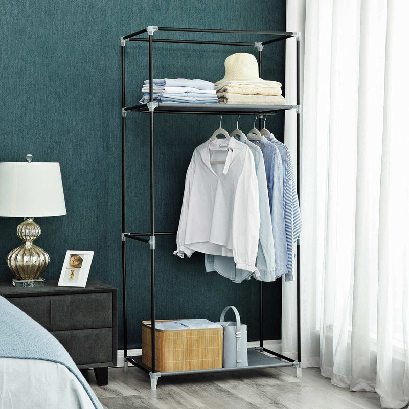 Wardrobe frame used with the cover removed, holding shirts and folded clothes against a teal bedroom wall