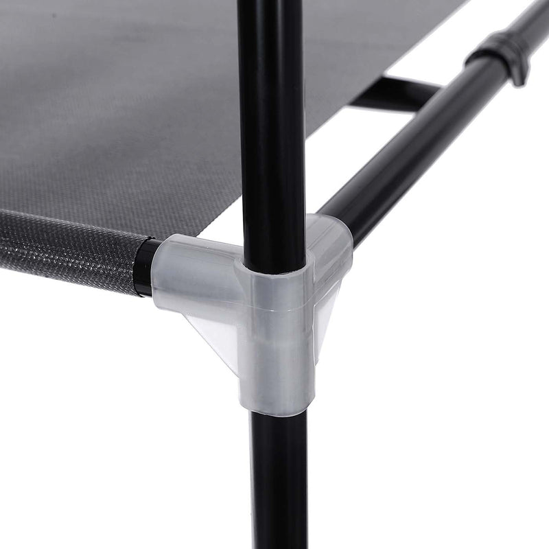Close-up of a fabric shelf clipped to the black steel tube at a translucent plastic corner connector