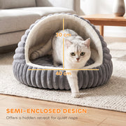 White cat stepping out of the cave bed showing the 40 x 30cm doorway
