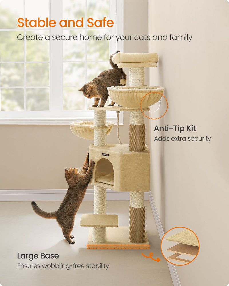 Cat climbing the Feandrea cat tree tower showing the wide anti-tip base and wall kit