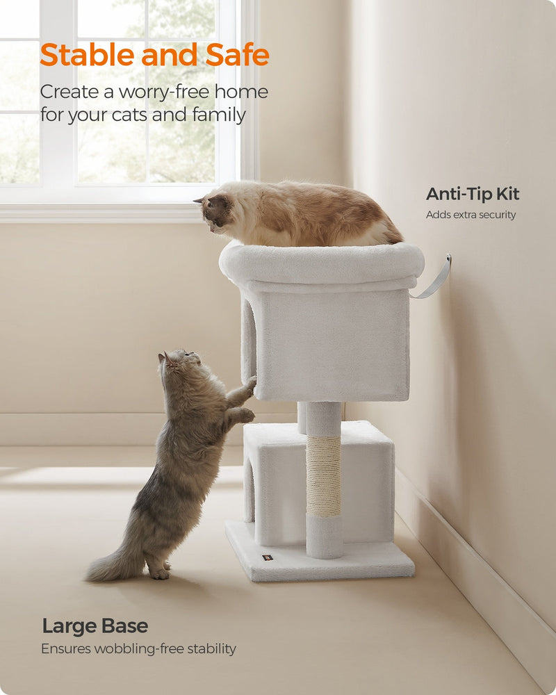 Feandrea cream white cat tree, cat using the multi-level tower