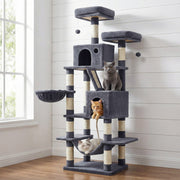 Smoky grey cat tree against a panelled wall with cats in the lower cave and hammock