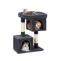Studio shot of the Feandrea 84cm cat tree tower with three cats using the top perch and both caves
