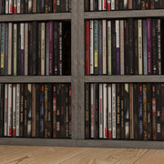 Close-up of compartments packed with CD cases
