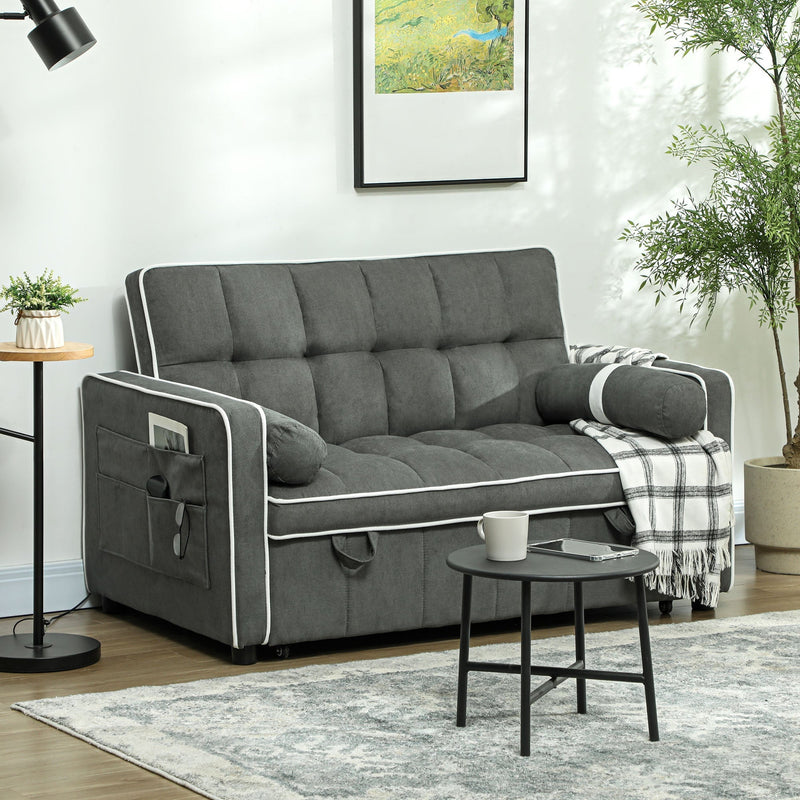 Charcoal grey sofa bed styled in a living room with a side pocket holding a magazine