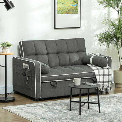 Charcoal grey sofa bed styled in a living room with a side pocket holding a magazine