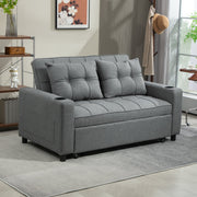 Charcoal grey sofa bed in a bright living room with a bookshelf