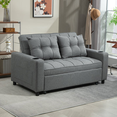 Charcoal grey sofa bed in a bright living room with a bookshelf