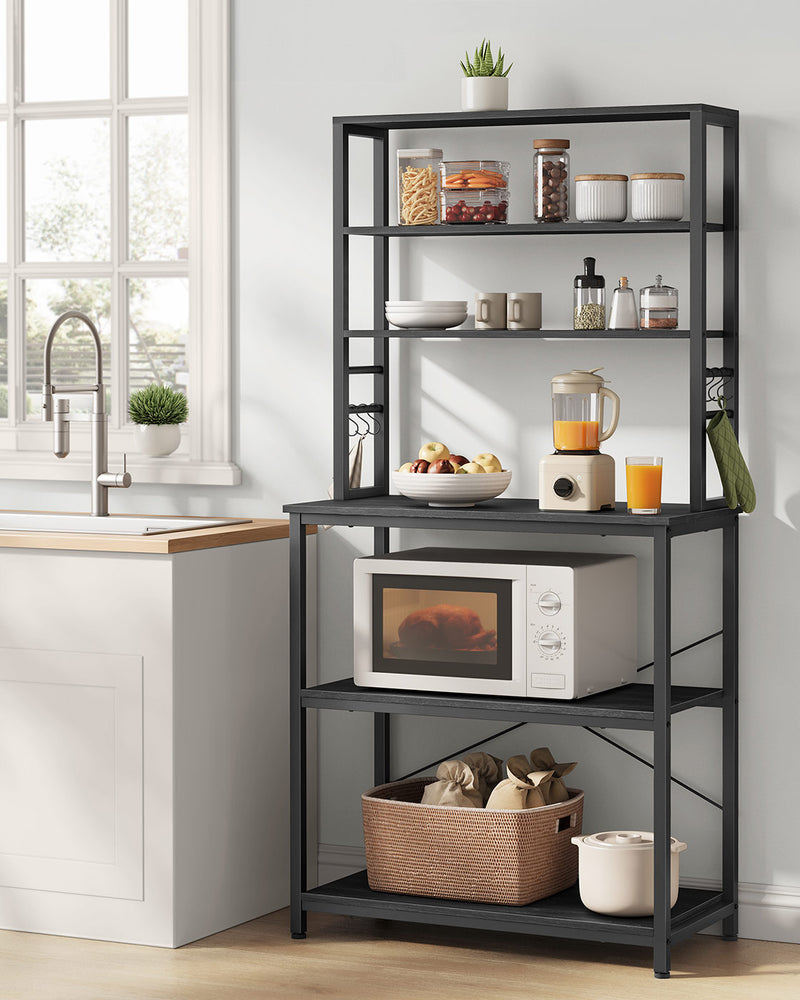 Close-up of the S-hooks holding mugs and utensils on the kitchen storage rack