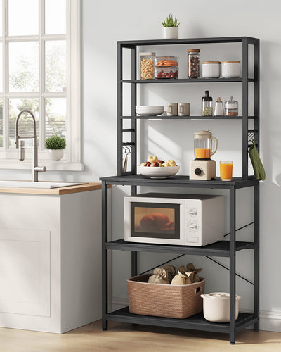 Close-up of the S-hooks holding mugs and utensils on the kitchen storage rack