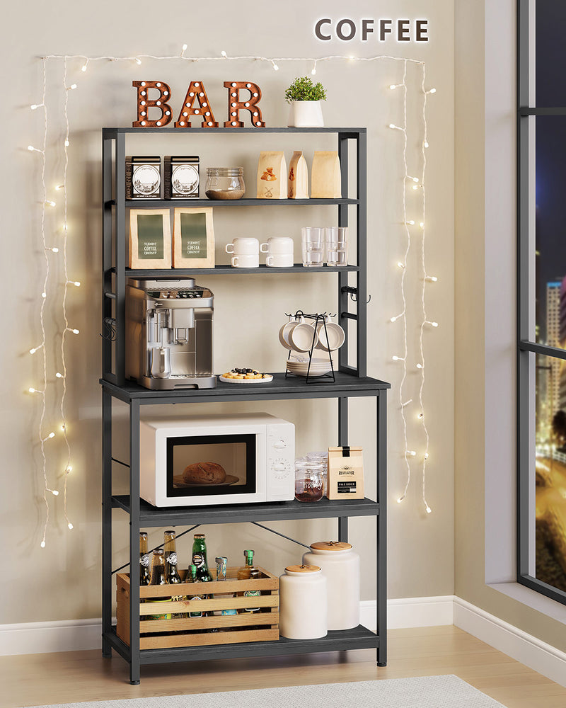 Kitchen storage rack shelves loaded with pans, jars and small appliances
