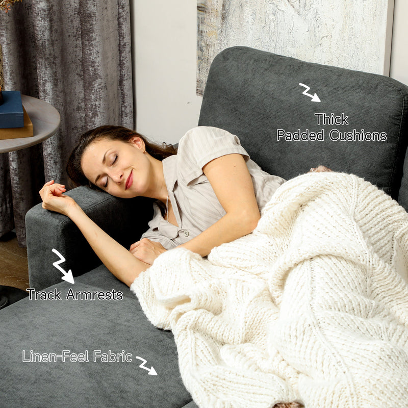 Woman resting on the sofa bed showing the padded cushions and linen-look fabric