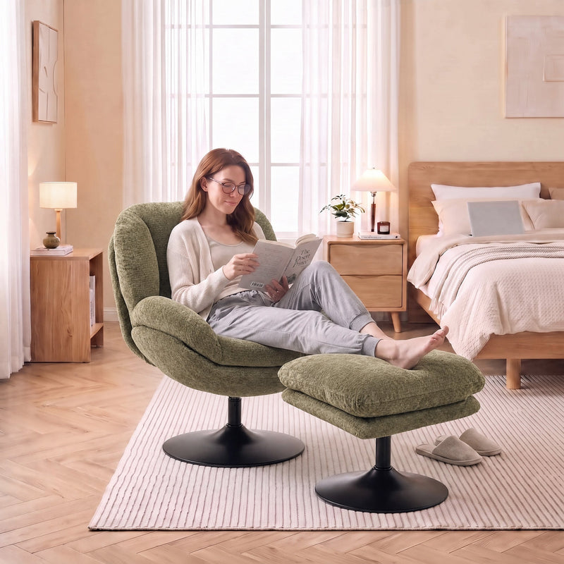 Woman with glasses reading in the dark green lazy chair in a bright bedroom