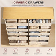 Open fabric drawers holding folded clothes and linens