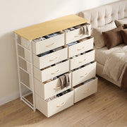Beige 10 drawer fabric chest of drawers in a styled bedroom setting