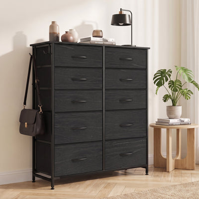 Black fabric chest of drawers with a bag on the side hook in a bedroom