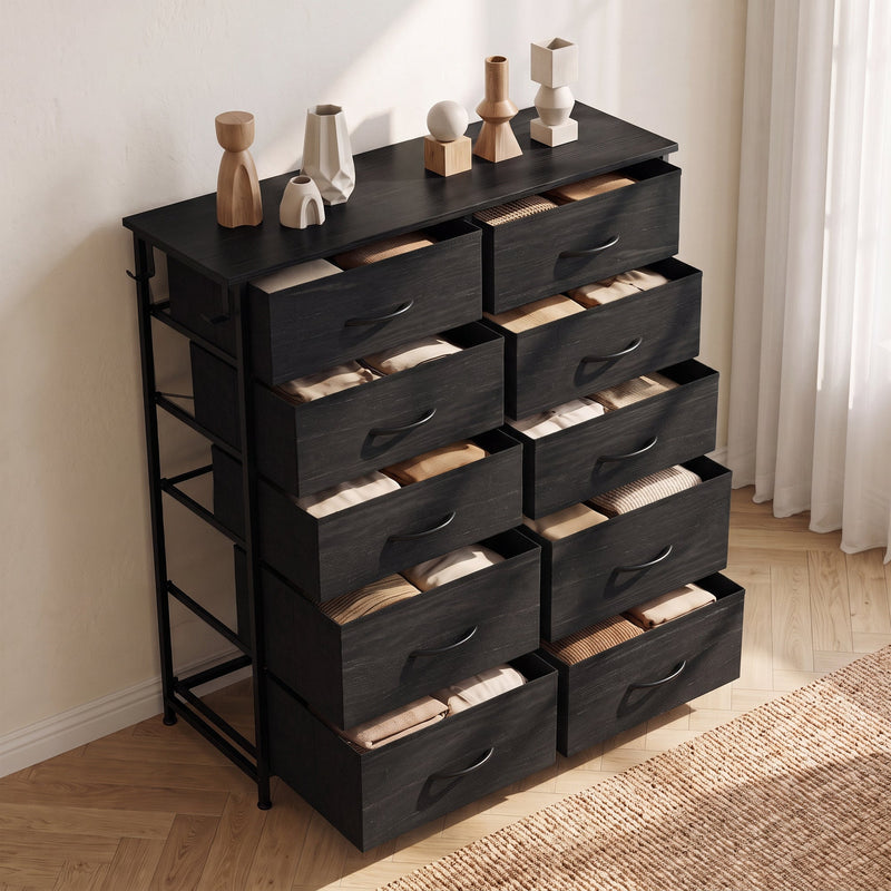 Black fabric chest of drawers with all drawers open and clothes inside