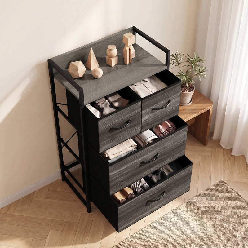 Angled lifestyle view with wooden ornaments on top and clothes folded in open drawers