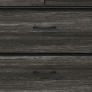 Close-up of the drawer fronts with slim metal pull handles
