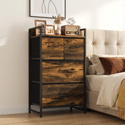 Four-drawer chest of drawers beside a bed with photo frames and a radio on top