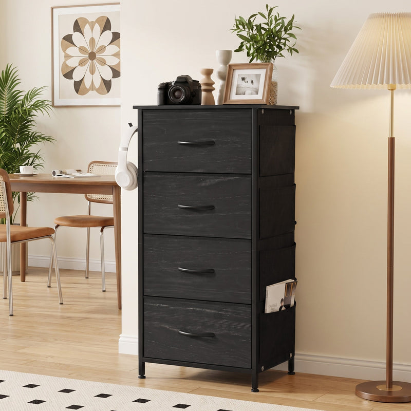 Black fabric chest of drawers styled in a living room next to a dining table